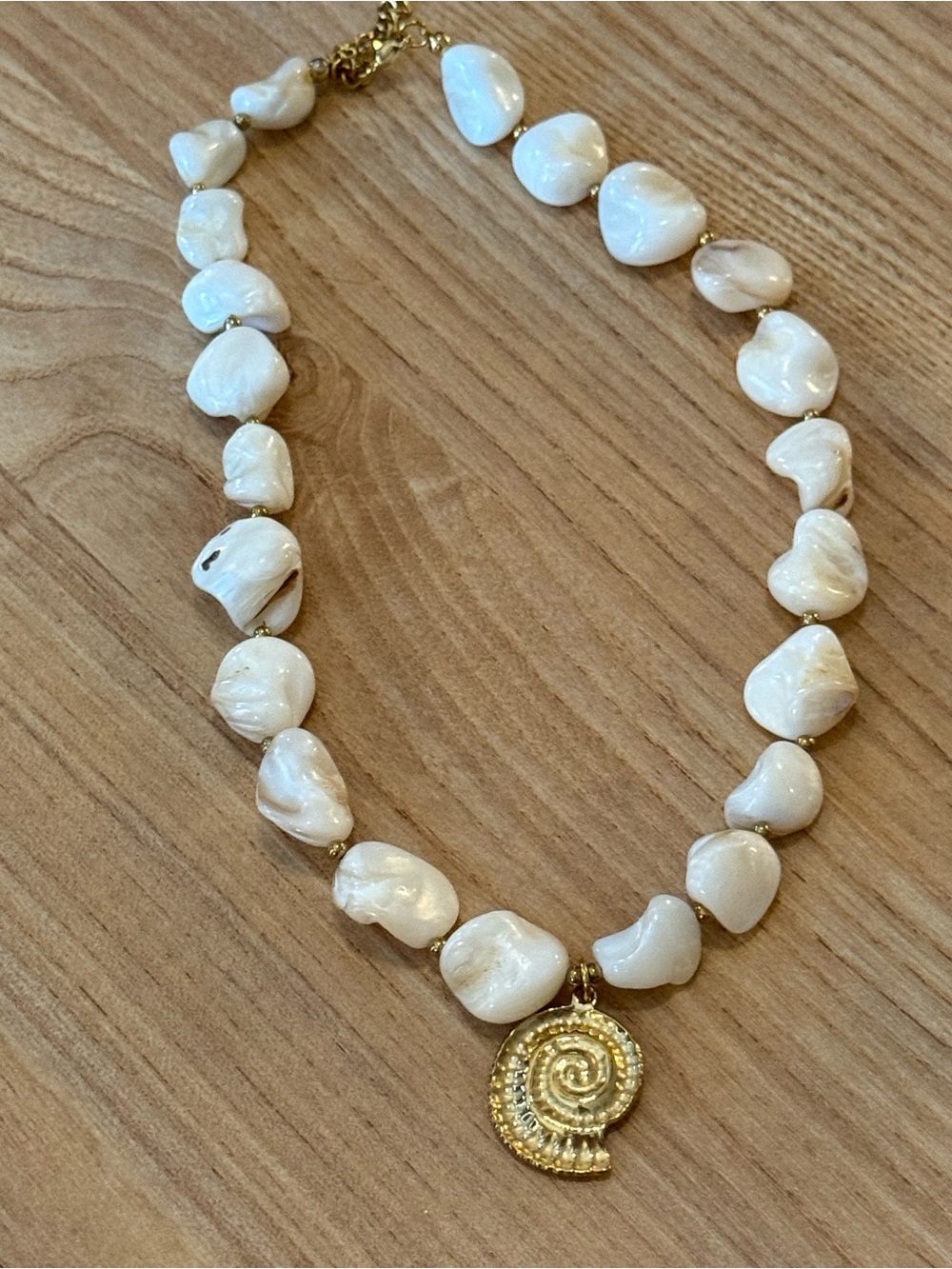 White beaded Necklace with Gold Spiral Pendant